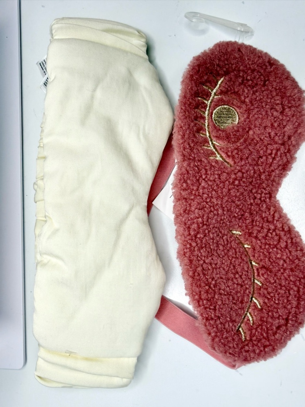 2 Plush Sherpa Sleep Eye Masks One In pink and The Other One In a Cream Color